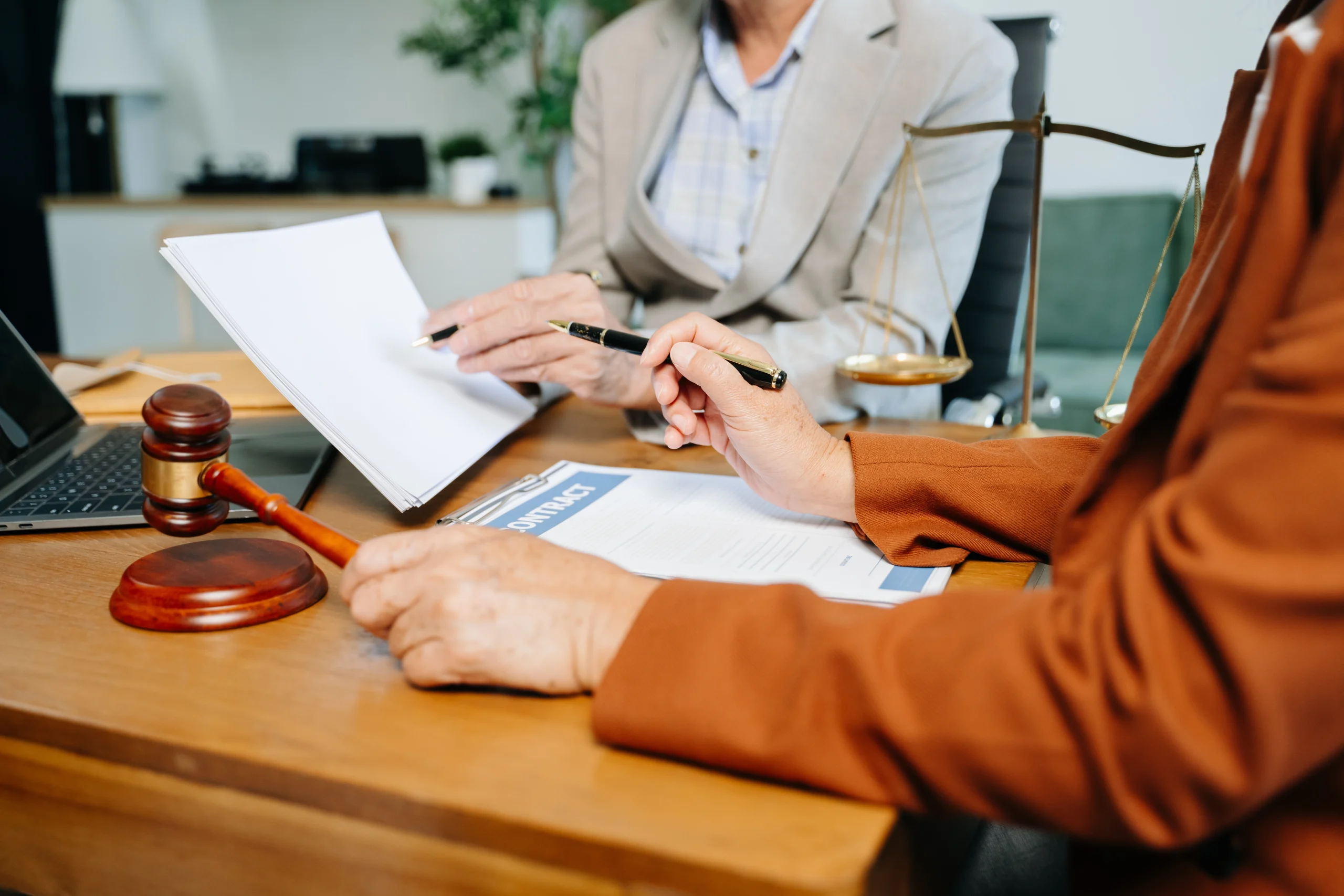 A focused estate lawyer in Johannesburg reviewing legal documents for a client's will or trust.